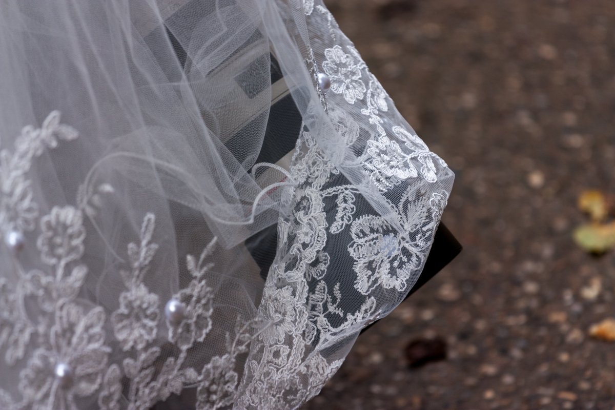IMG_8809-1.jpg - Photographer fixing the internals of the wedding dress
